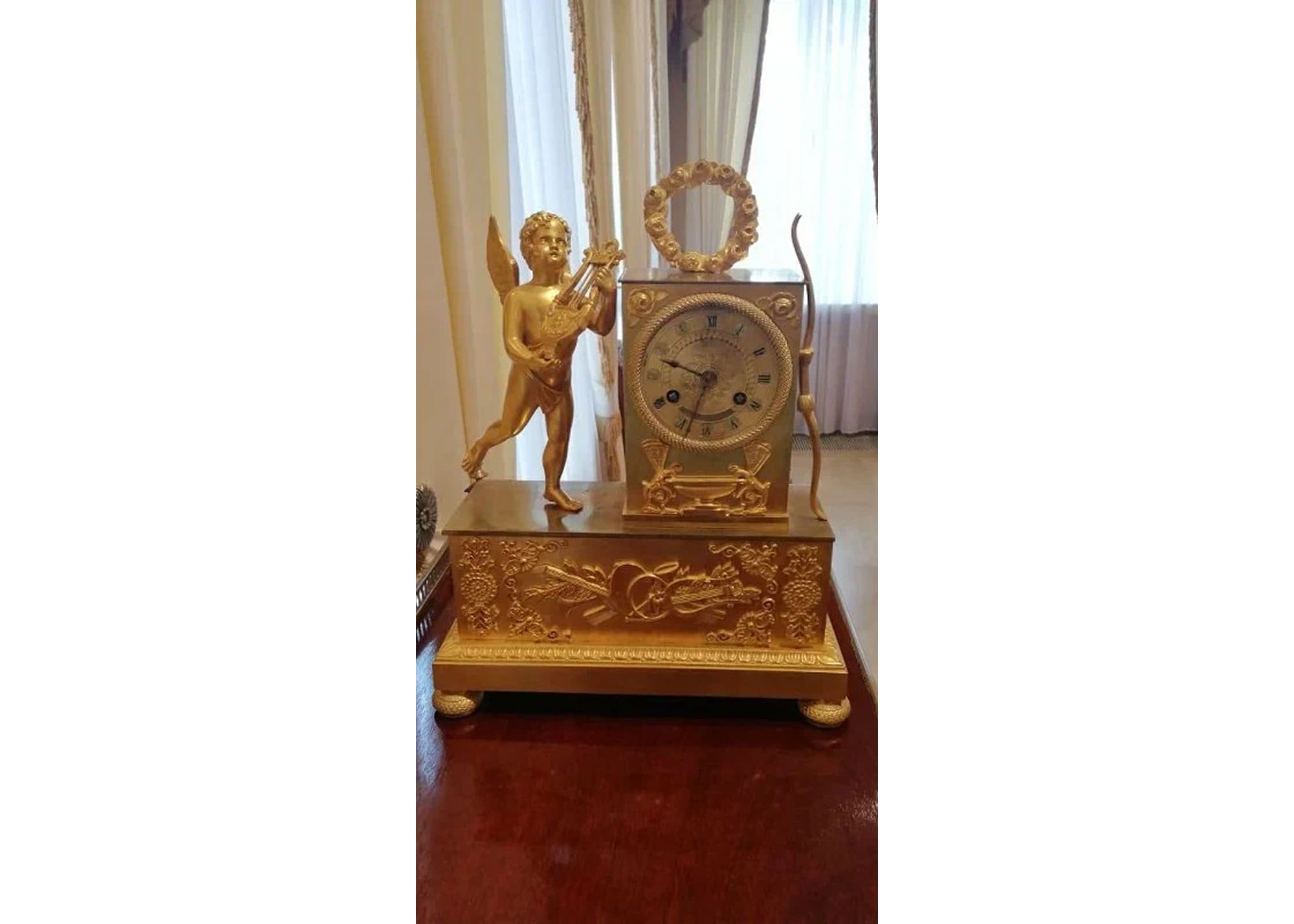 Часы каминные с фигурой амура. Франция. 1820-е